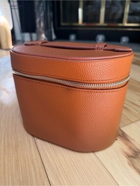 Women's Pebbled Faux Leather Toiletry Case in Cognac Orange